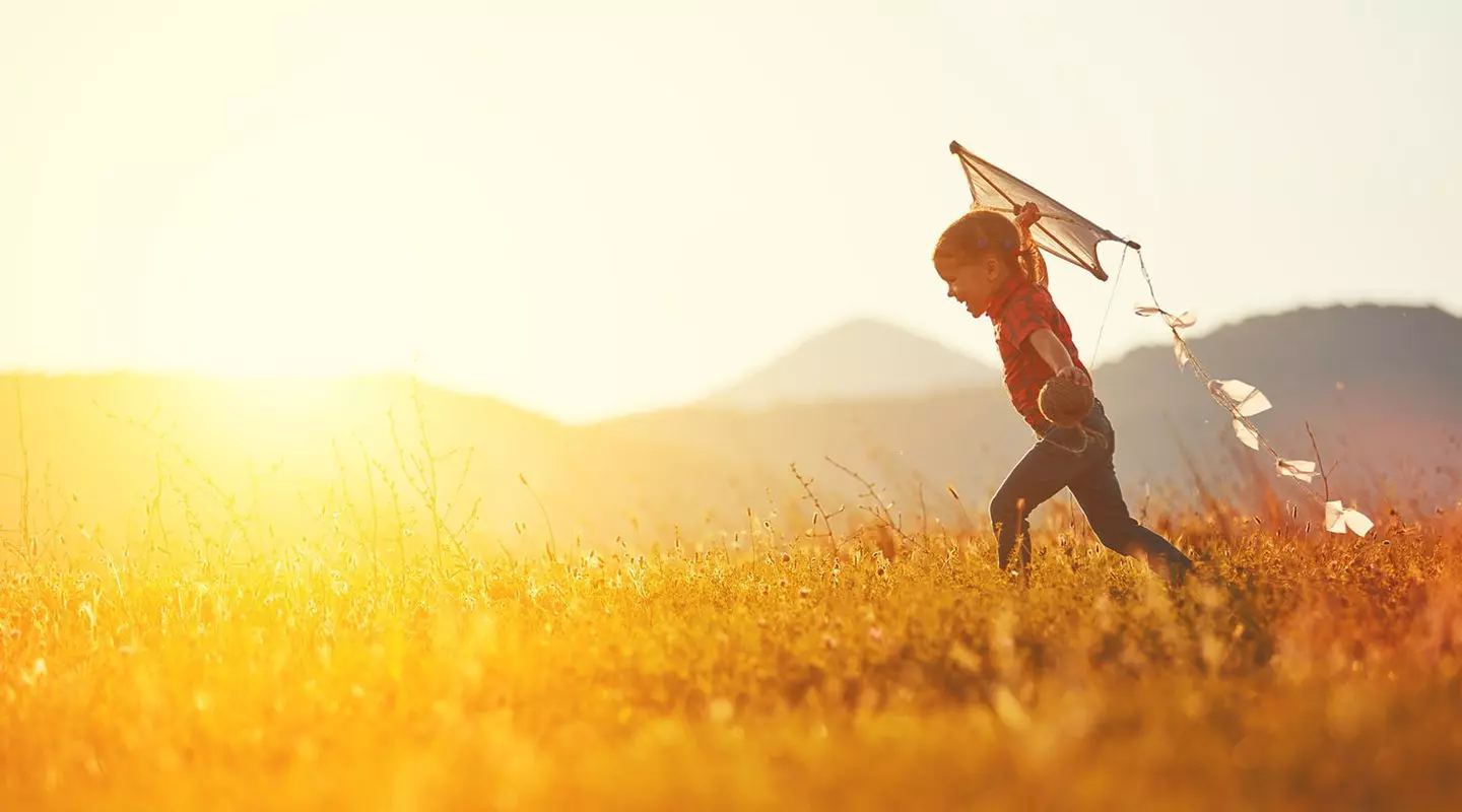 Child flying a kite