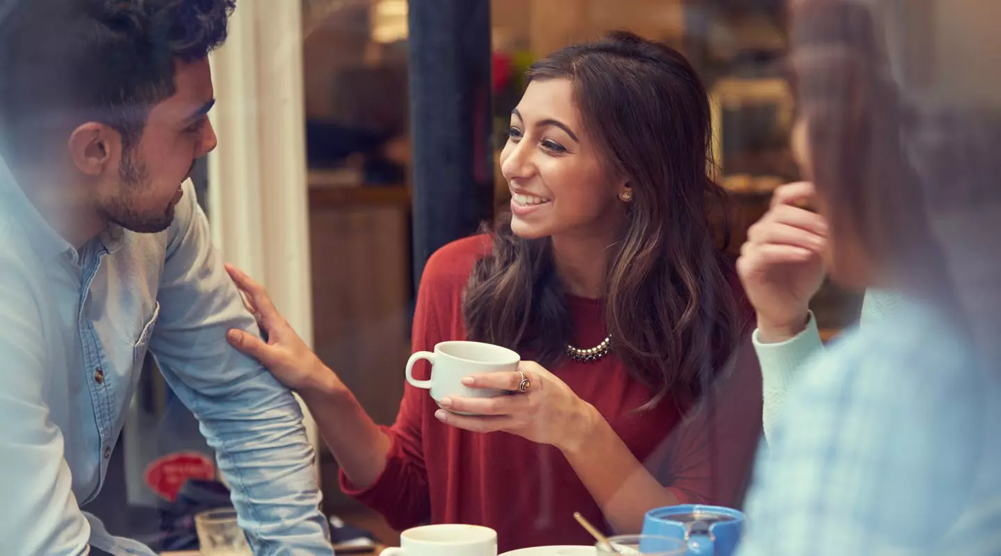Friends enjoying coffee at a coffee shop
