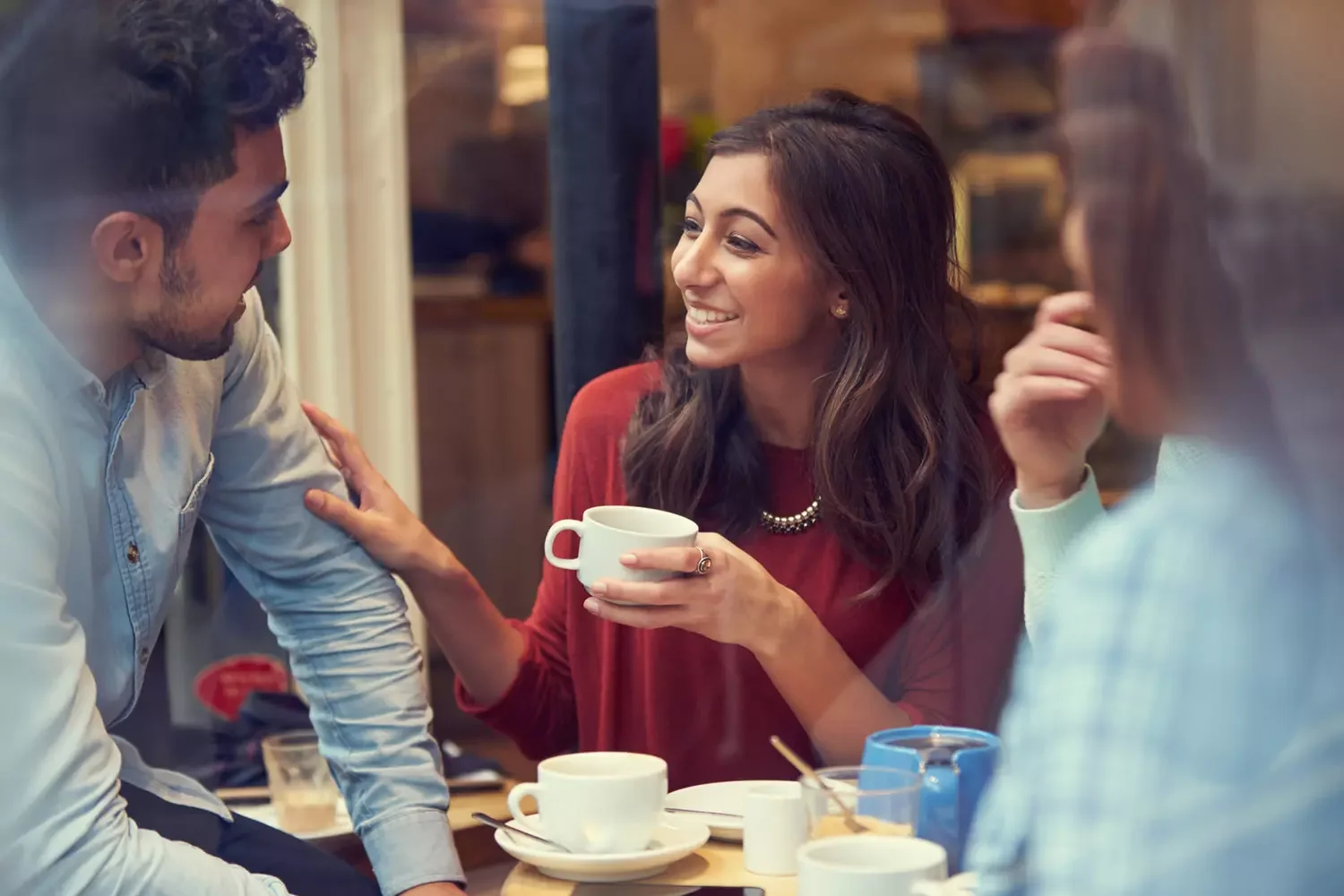 Friends enjoying coffee at a coffee shop