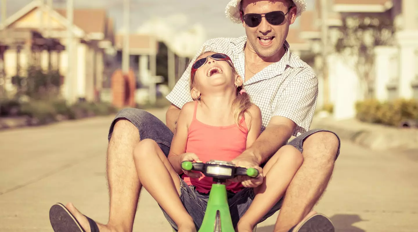 Father and daughter on scooter