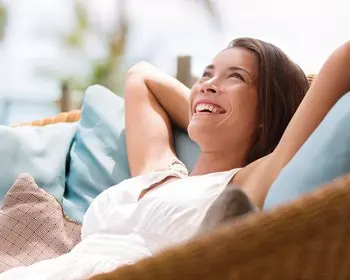 Woman relaxing laying back in chair
