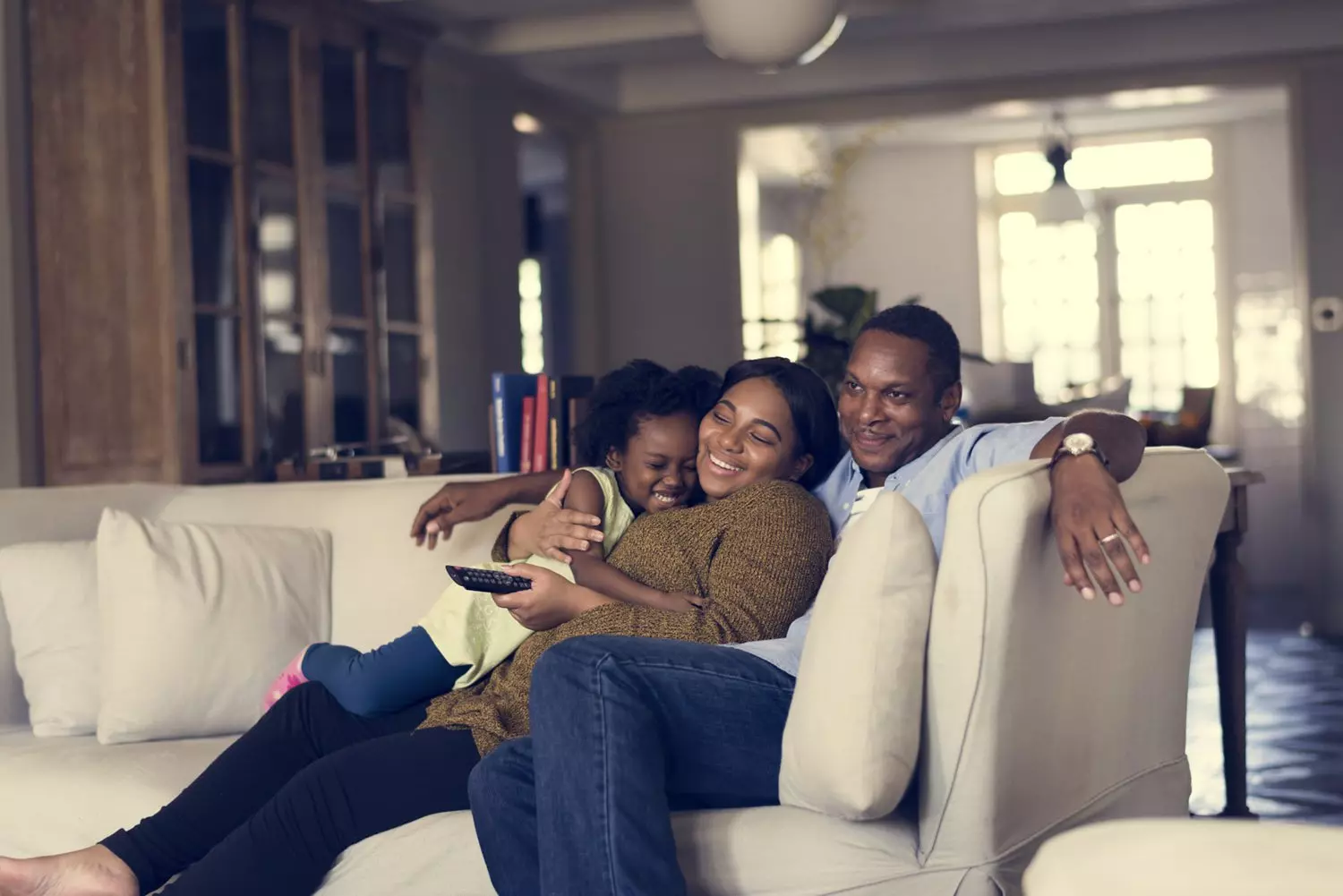 Family sitting watching tv