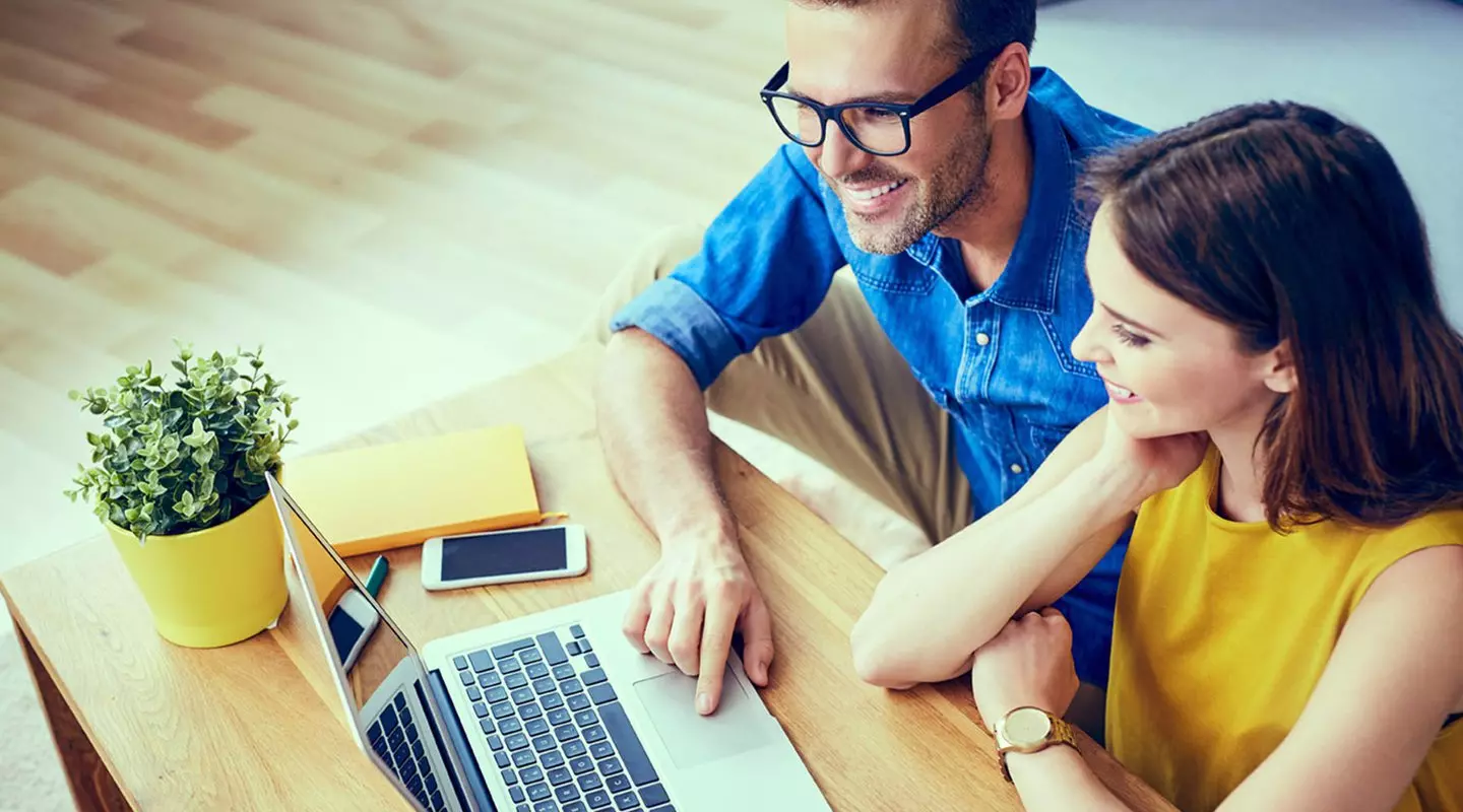 Couple looking at a laptop