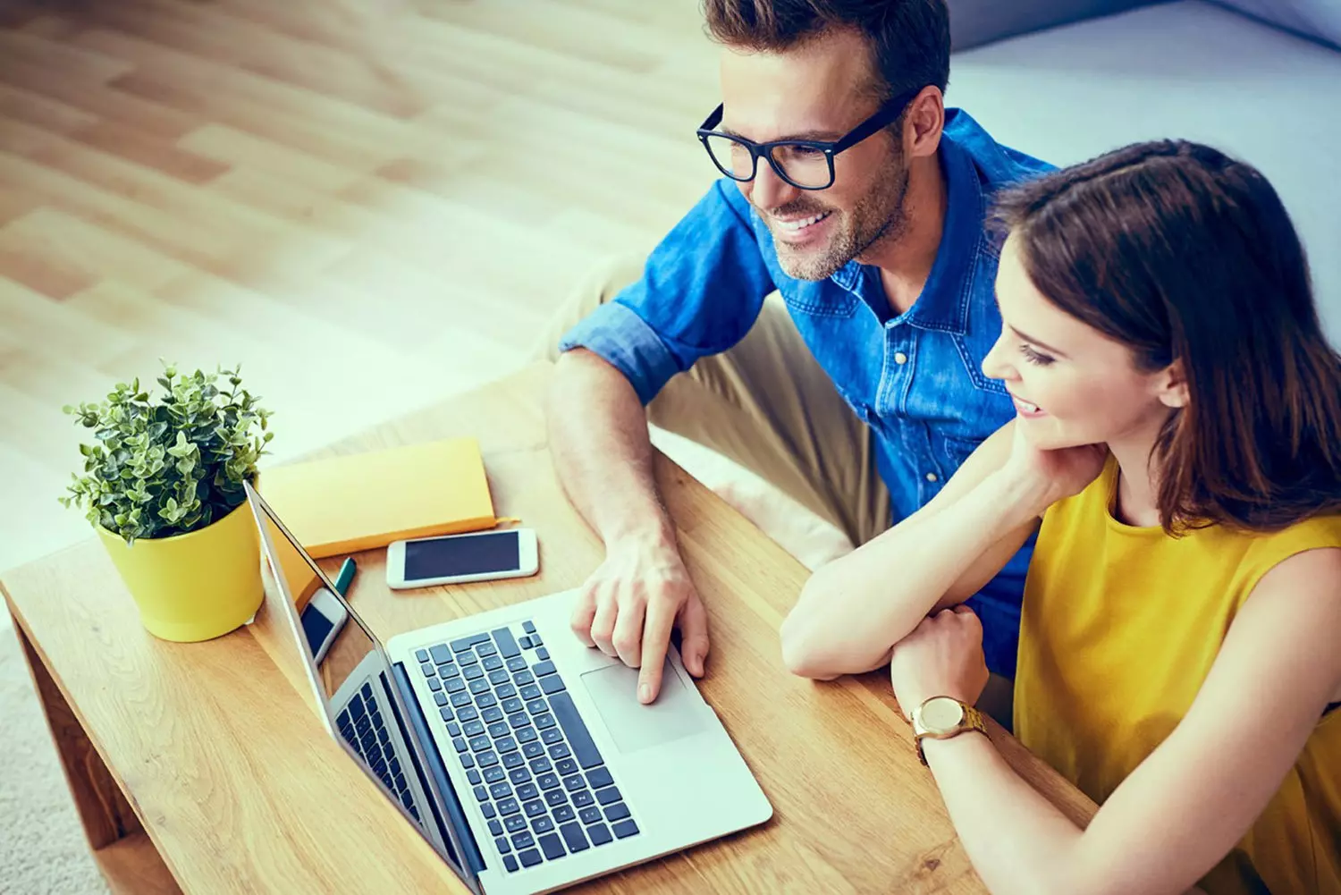 Couple looking at a laptop