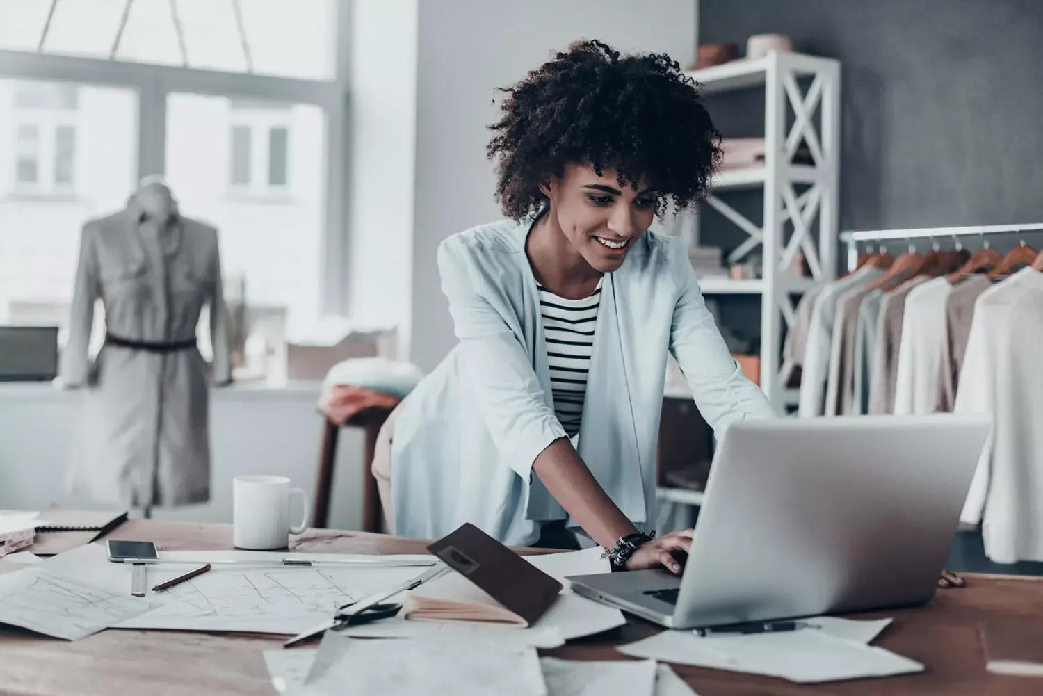 Business woman typing on laptop