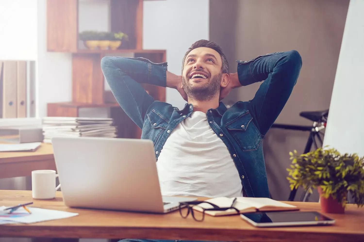 Man relaxing in front of laptop