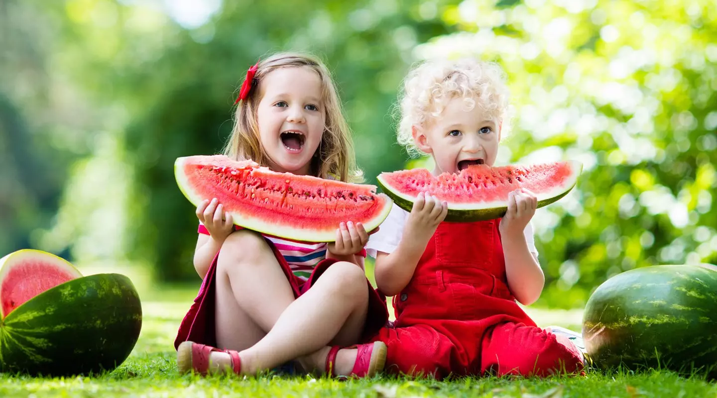 Kids eating watermelon