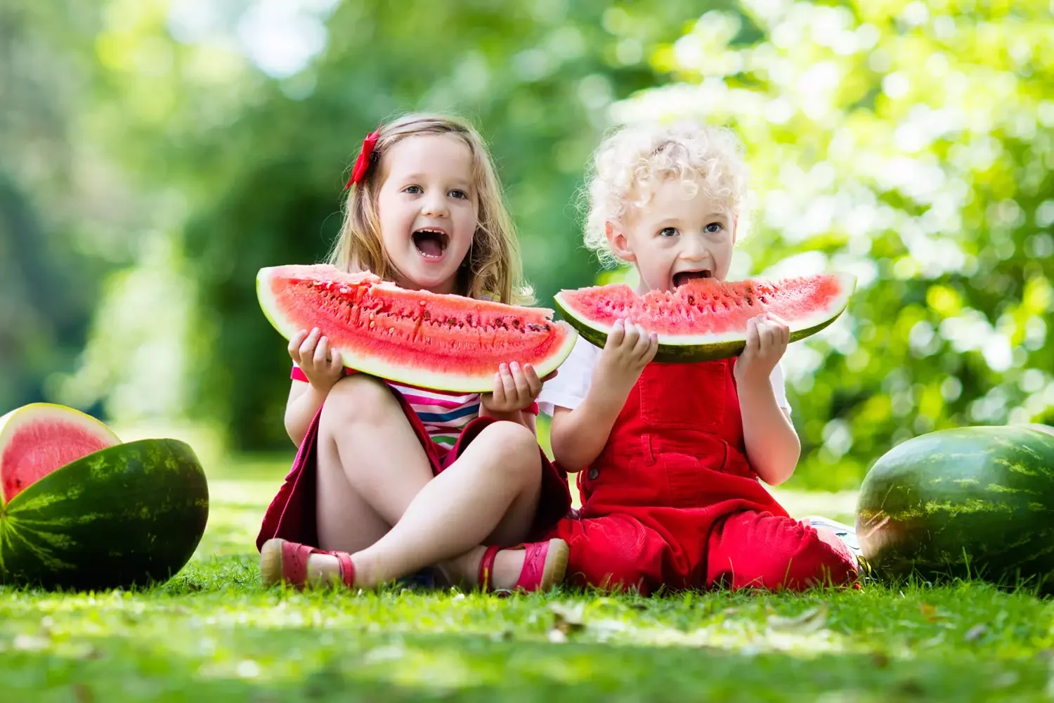 Kids eating watermelon