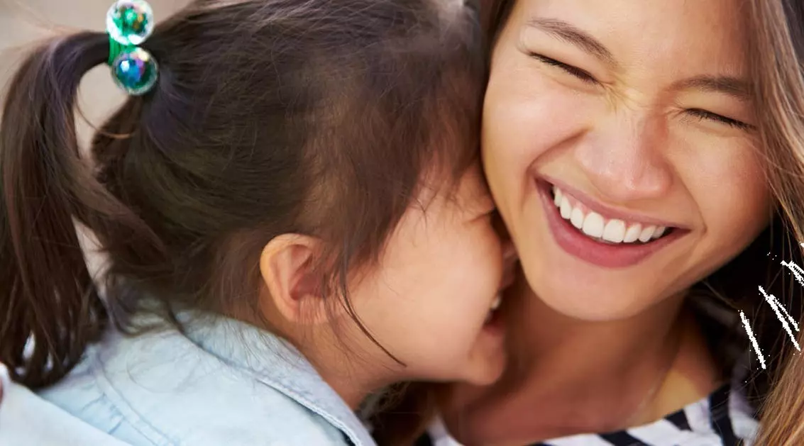 Mother and daughter hugging