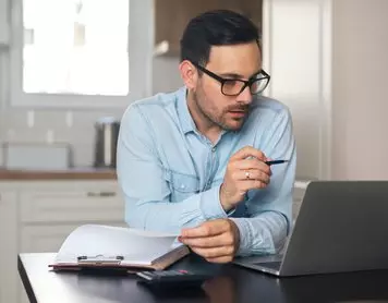 How much should you keep in checking and how much in savings?