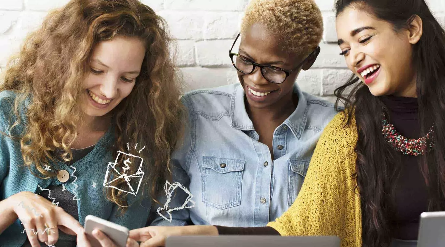 3 women pointing to phone