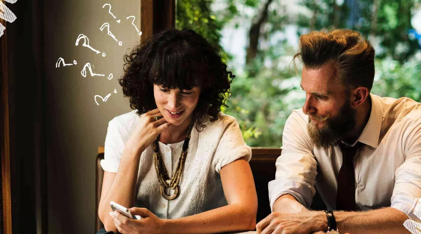 Young Couple Looking at Phone
