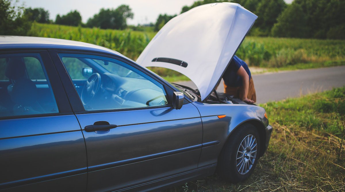 parked car with raised hood