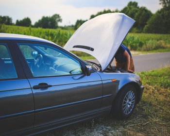 parked car with raised hood
