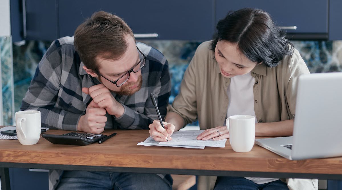 man and woman creating budget