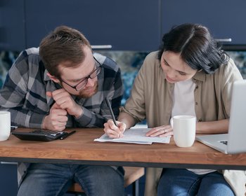 man and woman creating budget