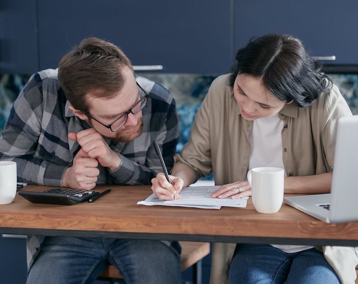 man and woman creating budget