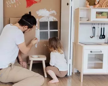 dad and daughter painting box house
