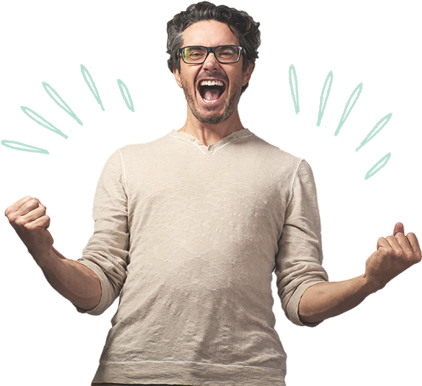 Excited smiling man making two fists wearing glasses and a beige t-shirt.